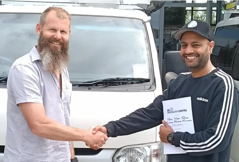 Mike Hardy shaking hands with The North Shore Plumber Operator Yahya Loukili